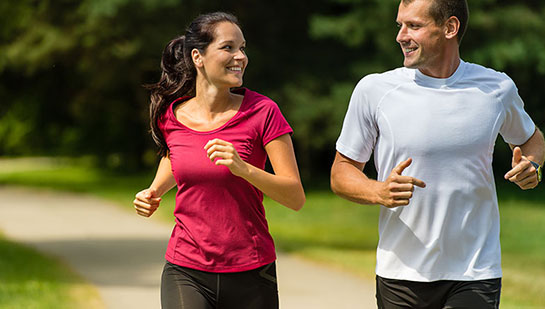 Husband and Wife out on a jog follow health advice from Concord chiropractor