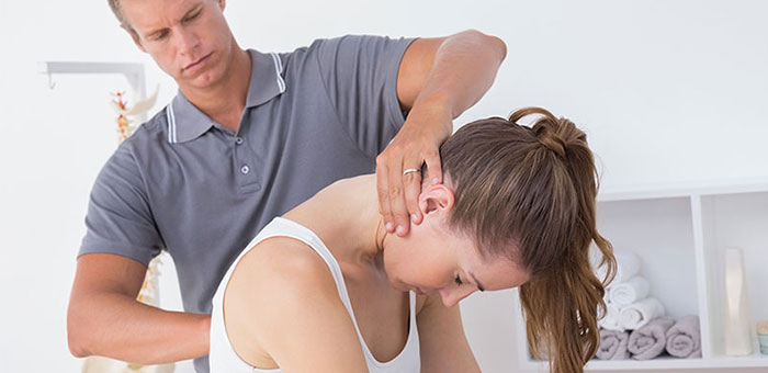 Woman receiving chiropractic adjustment from a Concord chiropractor