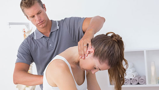 Woman receiving chiropractic adjustment from a Concord chiropractor