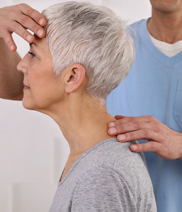 Patient receiving chiropractic adjusmtent for migraine relief from Concord Chiropractors