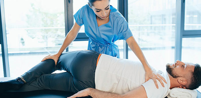 Patient receiving sciatica treatment from Concord chiropractor