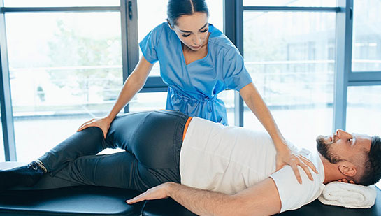 Patient receiving sciatica treatment from Concord chiropractor