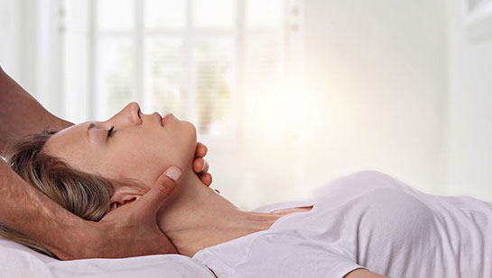 Woman receiving neck adjustment from Concord chiropractor