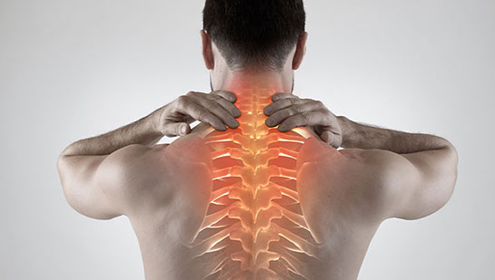 Man with upper back pain before chiropractic treatment from Concord chiropractor